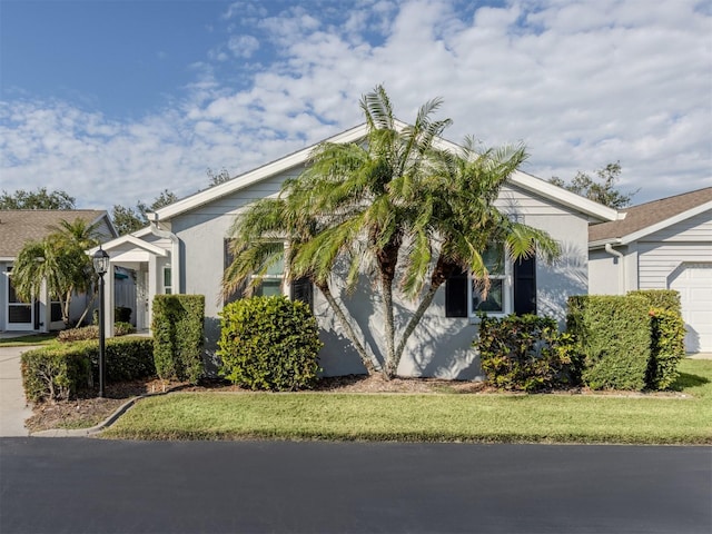 view of side of home featuring a lawn