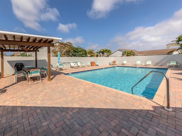 view of swimming pool with a patio area