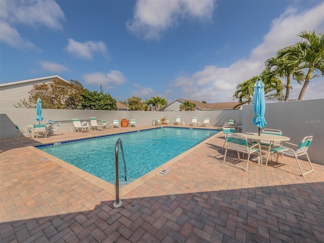 view of swimming pool featuring a patio