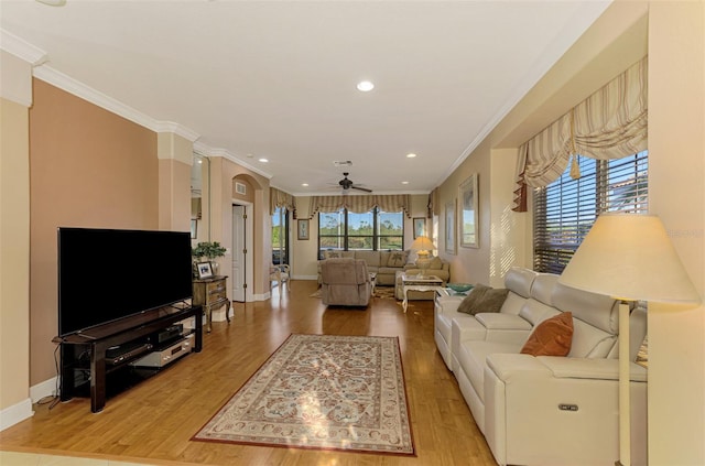 living room with hardwood / wood-style flooring and ornamental molding