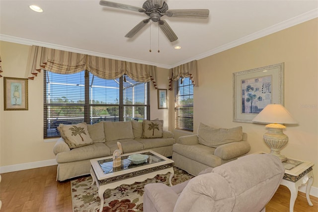 living room with ceiling fan, ornamental molding, and hardwood / wood-style flooring