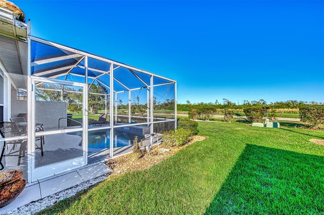 view of yard with a lanai