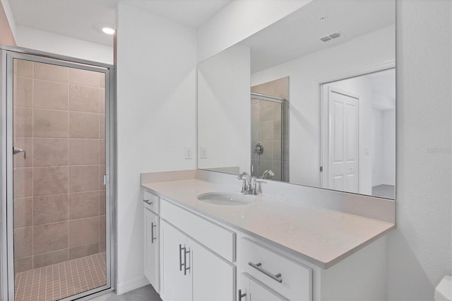 bathroom featuring vanity and walk in shower