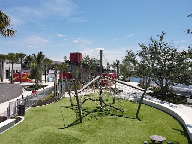 view of jungle gym featuring a lawn