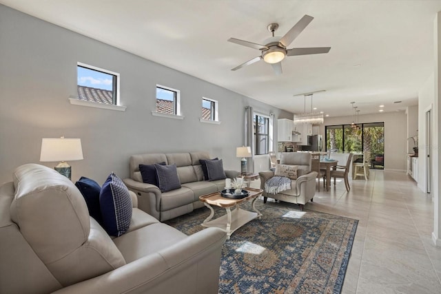 tiled living room featuring ceiling fan