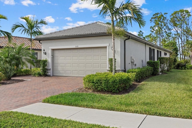 view of property exterior with a garage and a yard