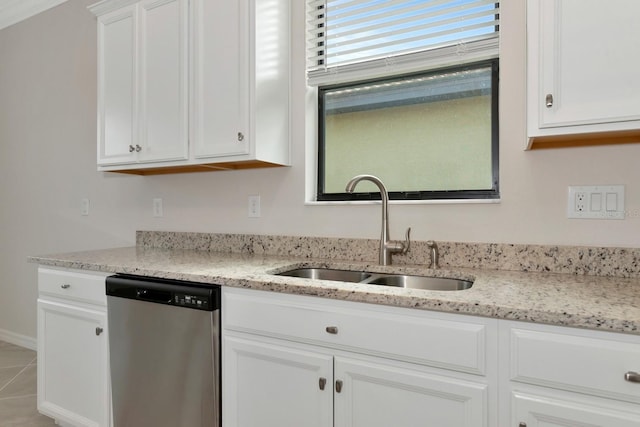 kitchen featuring a sink, light stone countertops, white cabinetry, and stainless steel dishwasher