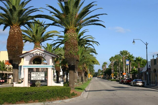 view of street featuring curbs and street lighting