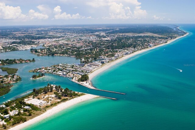 bird's eye view with a beach view and a water view