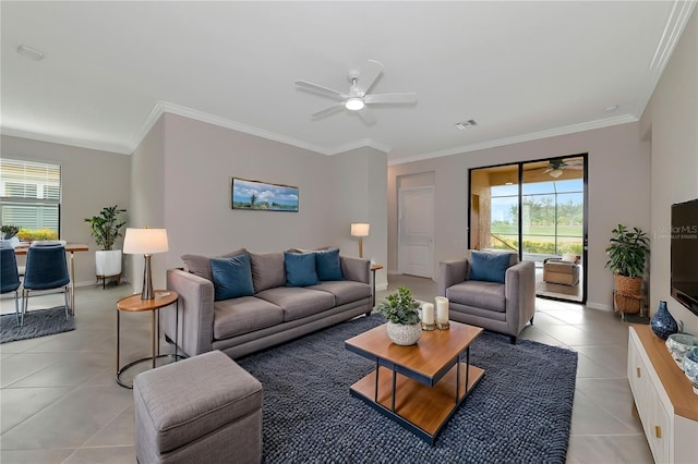 living room featuring crown molding, light tile patterned flooring, visible vents, and ceiling fan