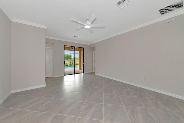 unfurnished room with visible vents, baseboards, and ornamental molding