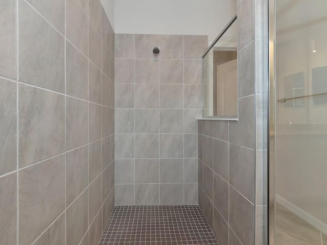 full bathroom with a tile shower