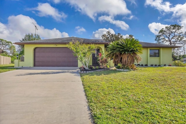 ranch-style house with a garage and a front lawn