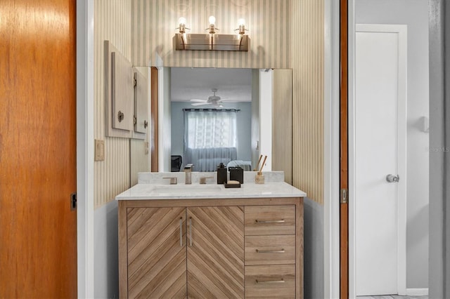 bathroom with ceiling fan and vanity