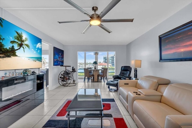 living room featuring ceiling fan and light tile patterned floors