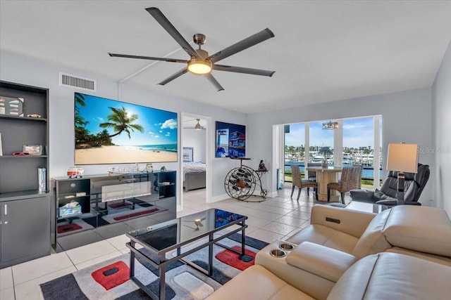 living room with ceiling fan and light tile patterned floors