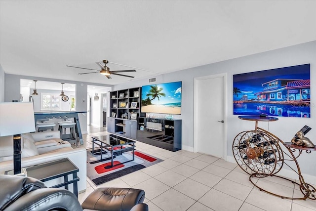 tiled living room featuring ceiling fan