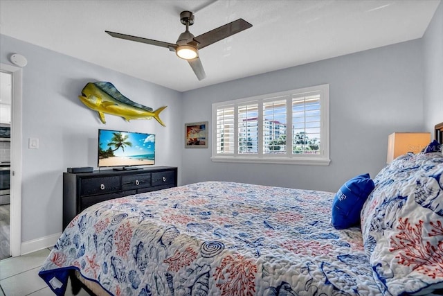 bedroom featuring light tile patterned floors and ceiling fan