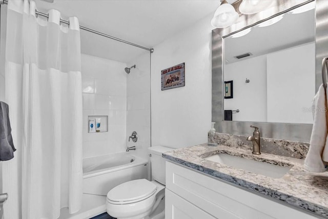 full bathroom with vanity, toilet, and shower / bath combo with shower curtain