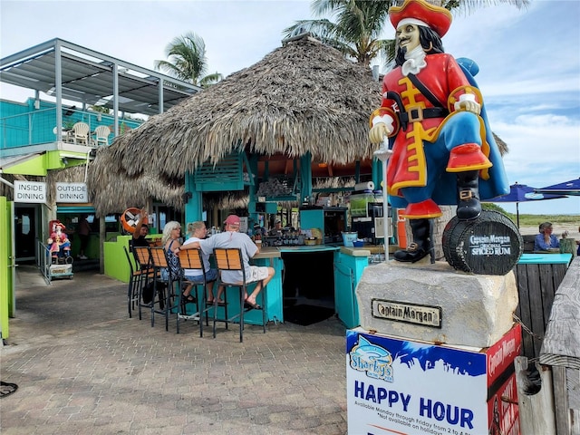 view of home's community featuring exterior bar