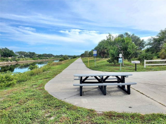 surrounding community with a water view