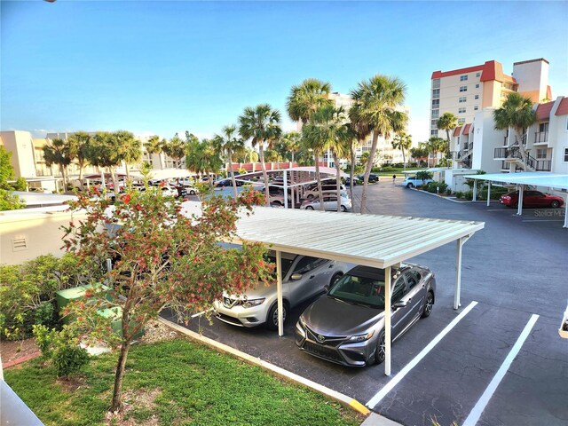 view of partially covered parking lot