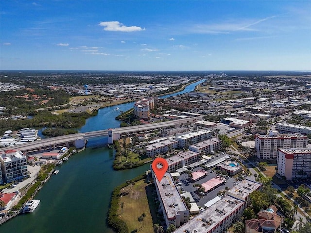 birds eye view of property featuring a city view and a water view
