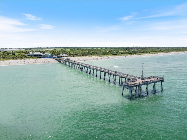 aerial view with a pier and a water view