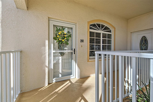 doorway to property featuring a balcony