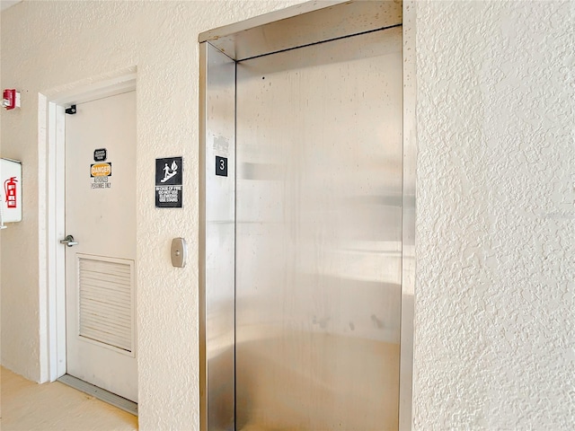 bathroom featuring elevator