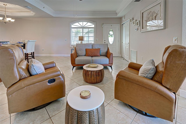 tiled living room with a tray ceiling, crown molding, and an inviting chandelier