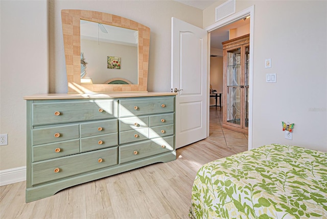 bedroom with light wood-type flooring