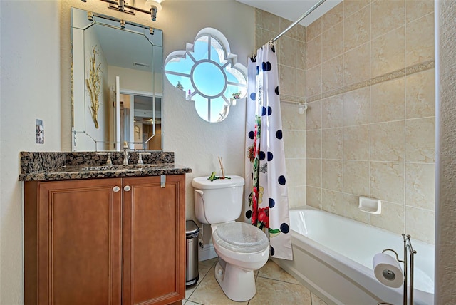 full bathroom featuring tile patterned floors, shower / tub combo with curtain, vanity, and toilet