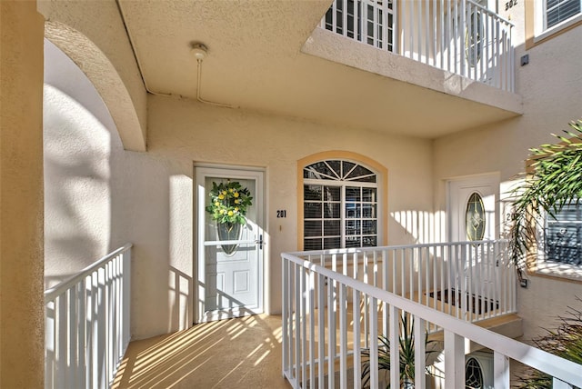 entrance to property with a balcony