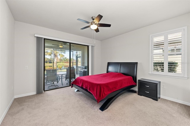 carpeted bedroom featuring ceiling fan and access to outside