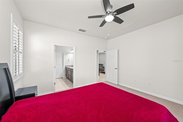 carpeted bedroom featuring ceiling fan and connected bathroom