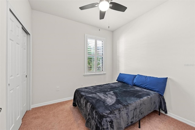 bedroom featuring carpet flooring, ceiling fan, and a closet