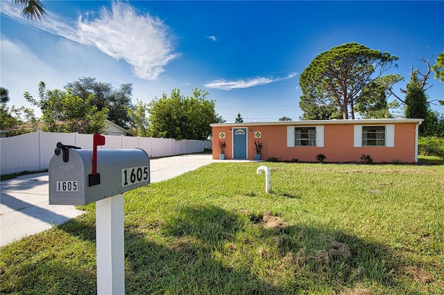 ranch-style home with a front yard