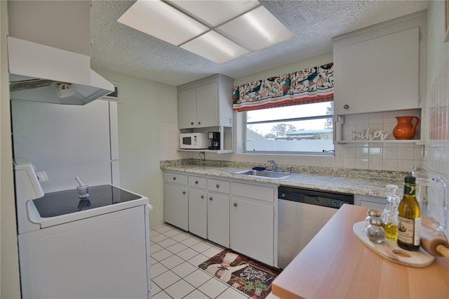 kitchen featuring white cabinetry, sink, stainless steel dishwasher, backsplash, and range