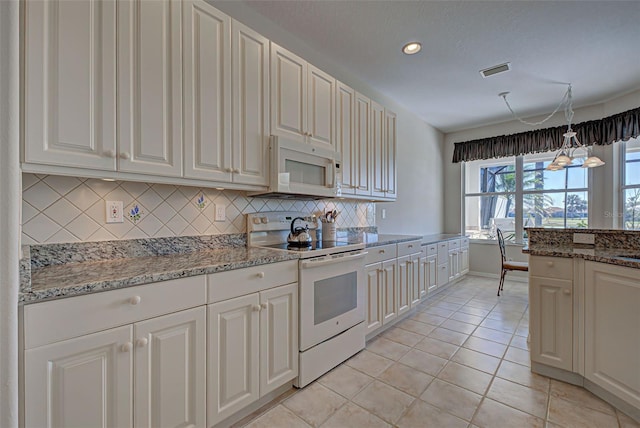 kitchen with light stone countertops, white appliances, decorative light fixtures, decorative backsplash, and light tile patterned floors