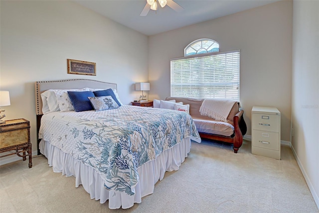 bedroom with ceiling fan and light carpet