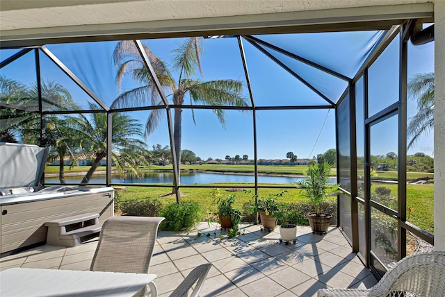 unfurnished sunroom with a water view and a wealth of natural light