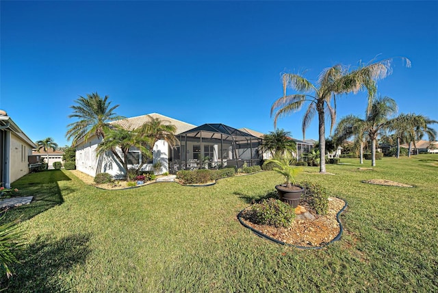 view of yard featuring a lanai