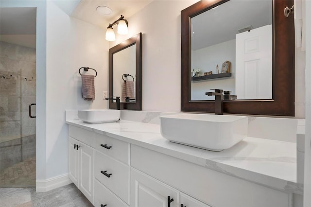 bathroom with vanity and walk in shower