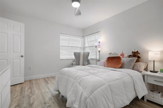 bedroom featuring light hardwood / wood-style floors and ceiling fan