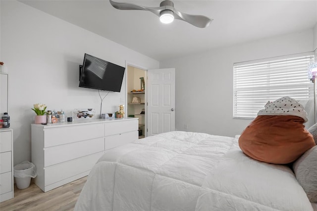 bedroom featuring light hardwood / wood-style floors and ceiling fan