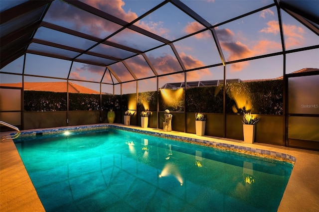 pool at dusk with glass enclosure