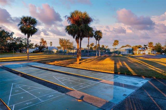 view of property's community with a yard