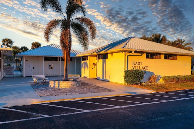 view of outdoor building at dusk