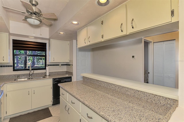 kitchen with ceiling fan, sink, light stone countertops, black dishwasher, and tasteful backsplash